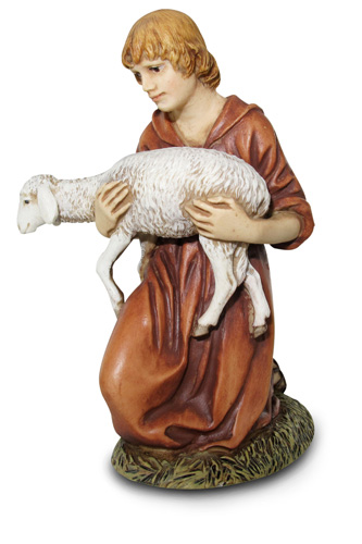 Pastore in ginocchio con agnello
